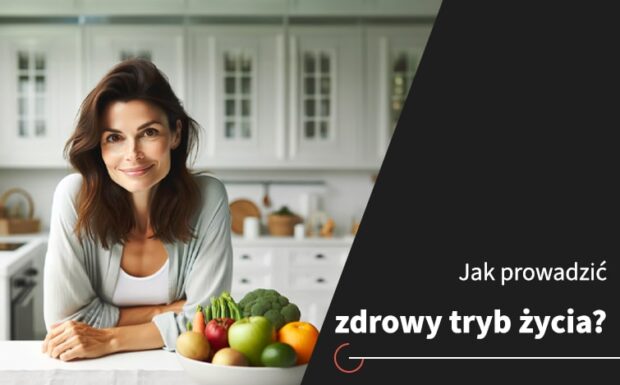 Jak prowadzić zdrowy tryb życia? Kobieta stoi w kuchni przy blacie, na którym stoi kosz owoców.